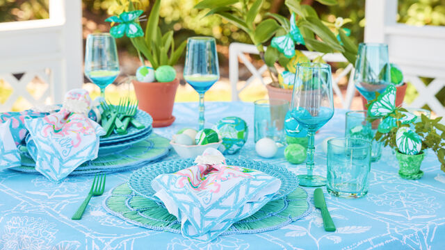 Tablescape decorated with blue and green decor
